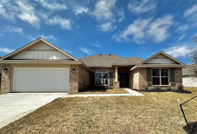 4318 Karam Lndg, Dickinson, TX 77539 - view of front of property with concrete driveway, a garage, brick siding, and a front yard