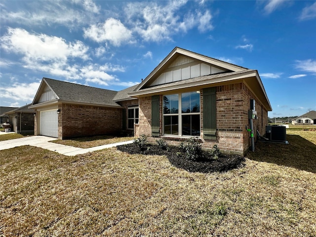 ranch-style house featuring board and batten siding, central air condition unit, a garage, and brick siding