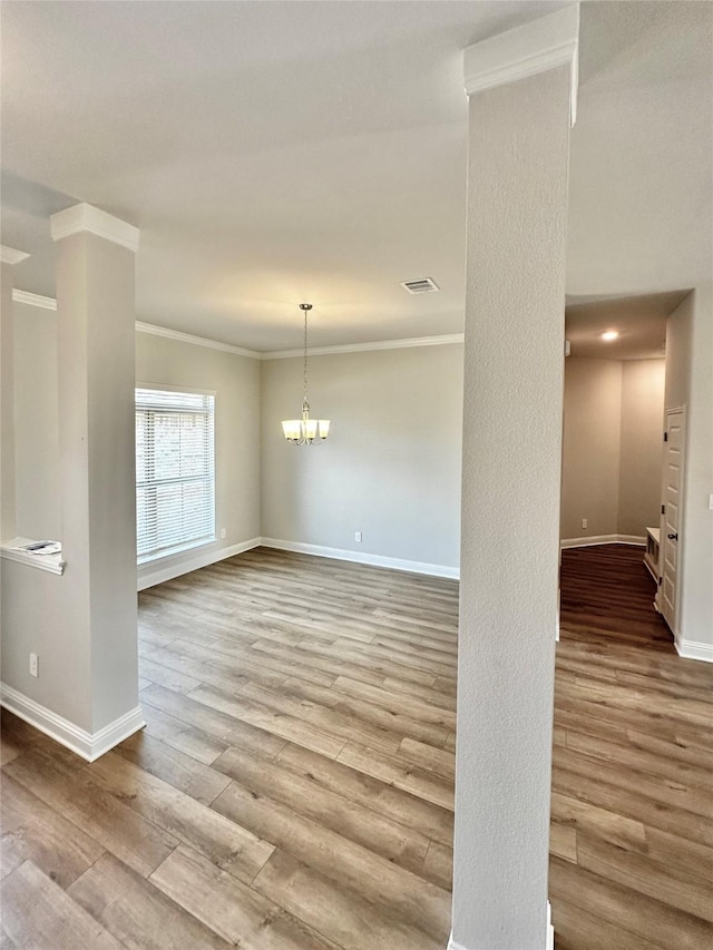 4318 Karam Lndg, Dickinson, TX 77539 - empty room featuring visible vents, baseboards, wood finished floors, and crown molding