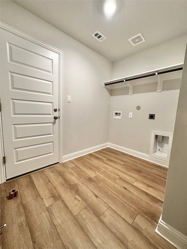 4318 Karam Lndg, Dickinson, TX 77539 - washroom with visible vents, hookup for an electric dryer, laundry area, light wood-style flooring, and washer hookup