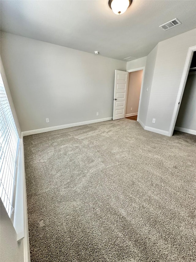 4318 Karam Lndg, Dickinson, TX 77539 - unfurnished bedroom featuring baseboards, visible vents, and carpet floors