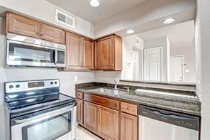 kitchen featuring stainless steel appliances and sink