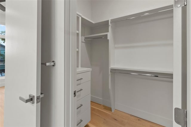 walk in closet featuring light wood-type flooring