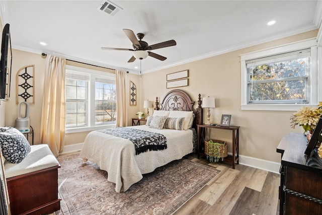 bedroom with multiple windows and ornamental molding