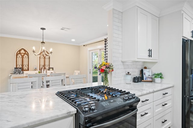 kitchen featuring light stone countertops, ornamental molding, black appliances, and white cabinets