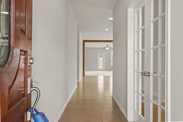 hallway featuring light tile patterned floors