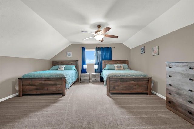 bedroom with carpet, baseboards, vaulted ceiling, and a ceiling fan