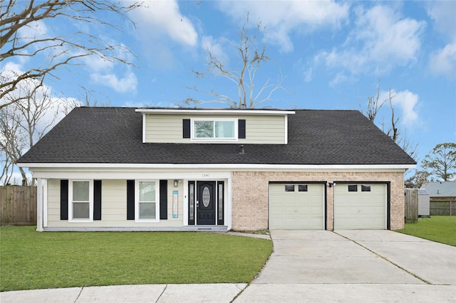 traditional-style house featuring a front lawn, fence, concrete driveway, roof with shingles, and a garage