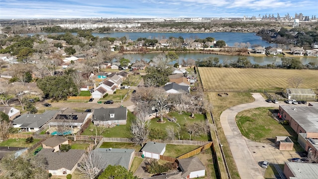 bird's eye view featuring a water view and a residential view