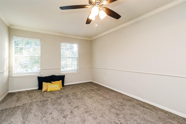 spare room featuring crown molding, carpet floors, and ceiling fan