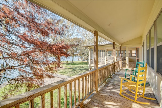 wooden terrace with a yard