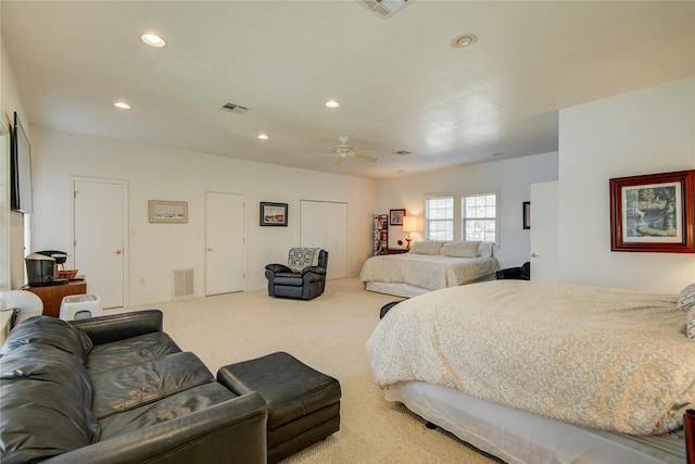 carpeted bedroom featuring visible vents, recessed lighting, and a ceiling fan