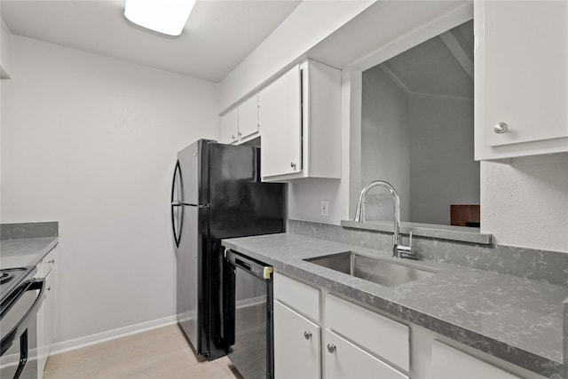 kitchen with white cabinets, light hardwood / wood-style floors, sink, and black appliances