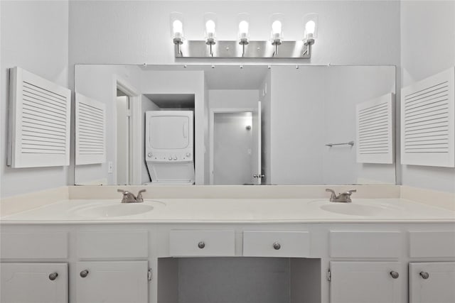 bathroom featuring stacked washer and dryer and vanity