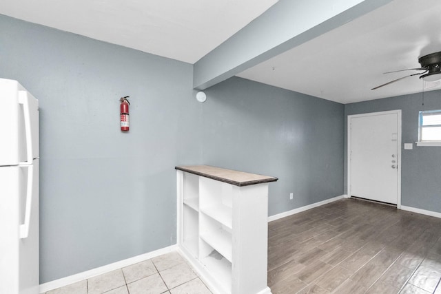 interior space featuring hardwood / wood-style floors and ceiling fan