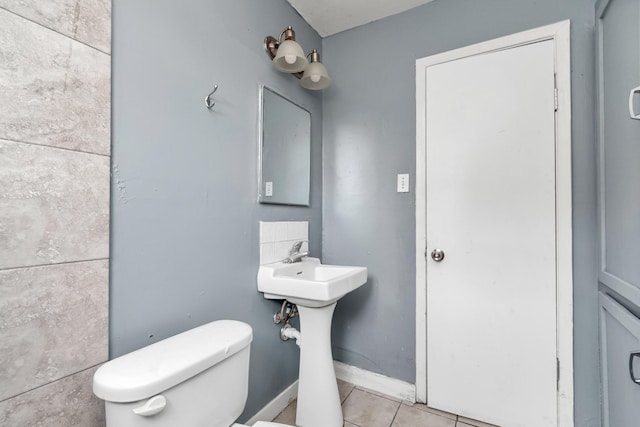 bathroom featuring tile patterned floors and toilet