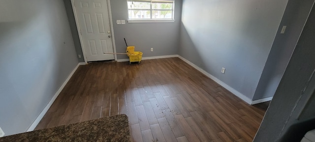 empty room featuring dark hardwood / wood-style flooring