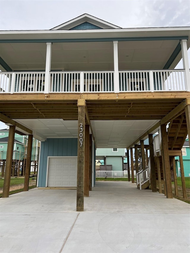 view of front of house featuring a garage and a carport