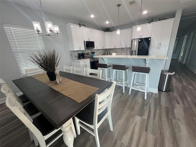 dining area featuring hardwood / wood-style floors