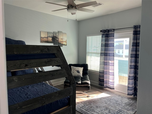 bedroom with hardwood / wood-style floors and ceiling fan