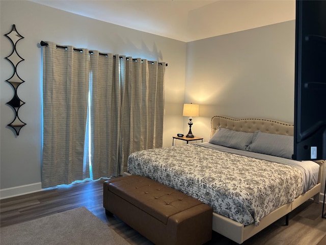 bedroom featuring wood-type flooring