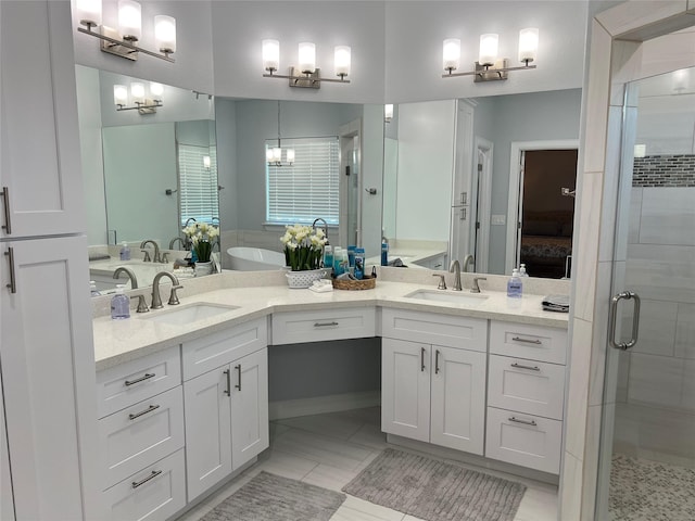 bathroom with vanity and independent shower and bath