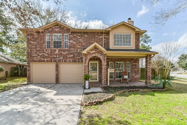 front facade with a garage, a front yard, and a porch