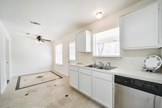 kitchen featuring ceiling fan, dishwasher, sink, and white cabinets