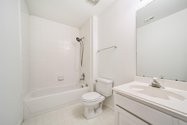 full bathroom with tiled shower / bath, vanity, and toilet