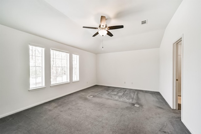 empty room featuring baseboards, carpet, visible vents, and a ceiling fan