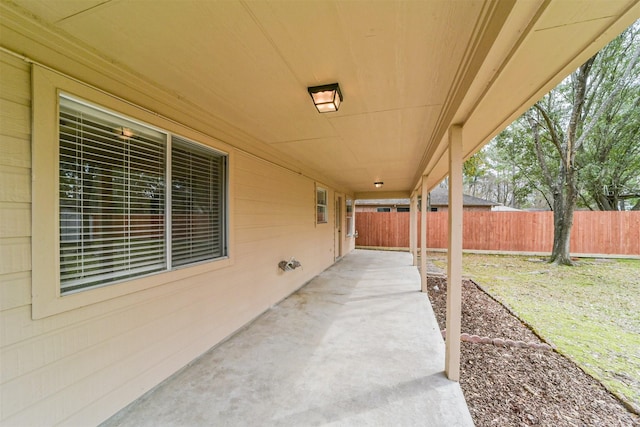 view of patio / terrace featuring fence