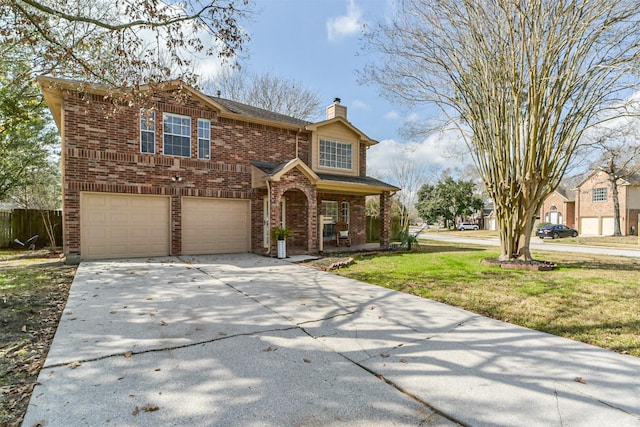 traditional-style home with brick siding, a chimney, a garage, driveway, and a front lawn