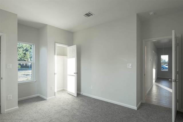 unfurnished bedroom with carpet flooring