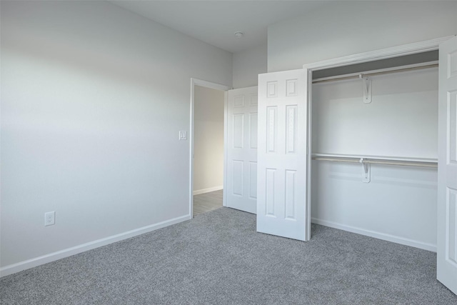 unfurnished bedroom with carpet floors and a closet