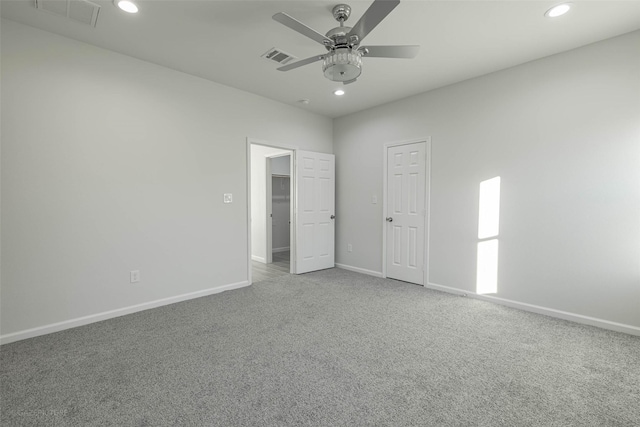 unfurnished bedroom featuring carpet floors and ceiling fan