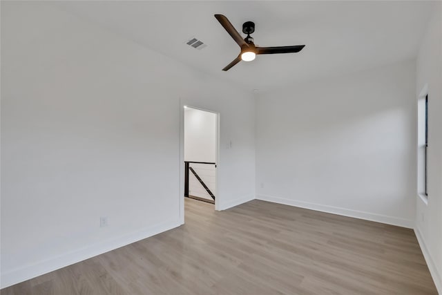 unfurnished room with light hardwood / wood-style flooring and ceiling fan