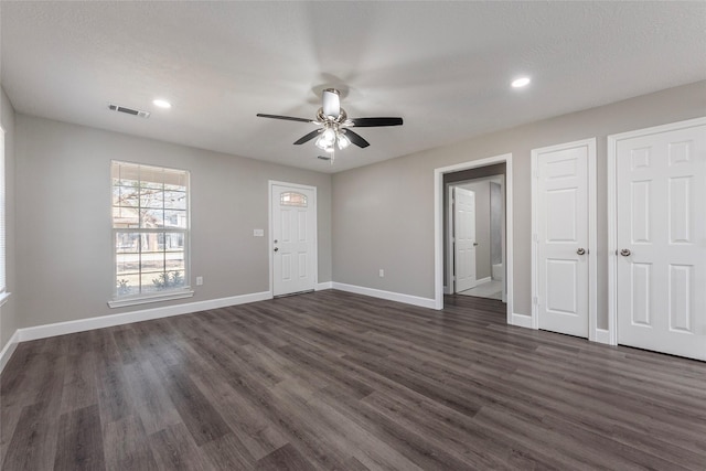 interior space featuring ceiling fan and dark hardwood / wood-style floors