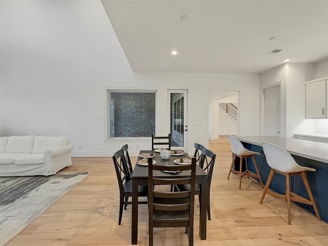 dining area with light hardwood / wood-style floors