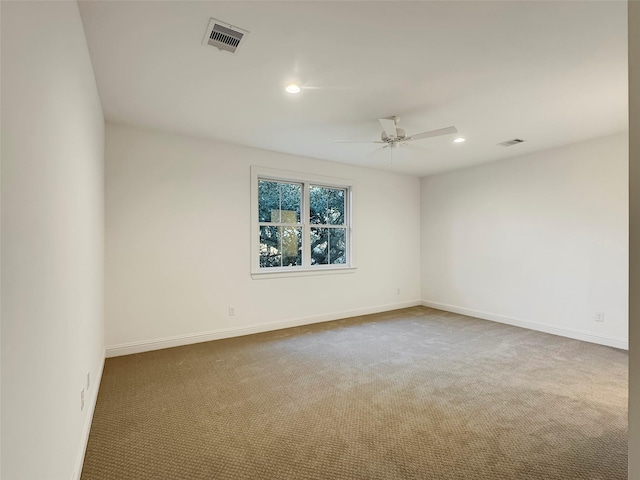 spare room with carpet flooring and ceiling fan