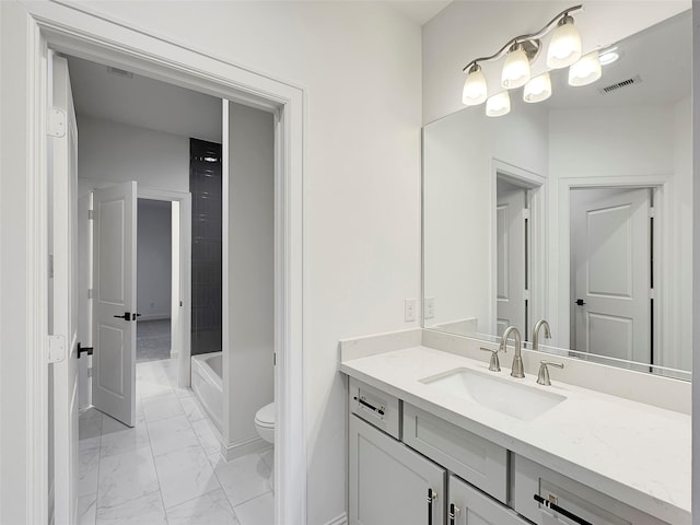 bathroom with vanity and toilet