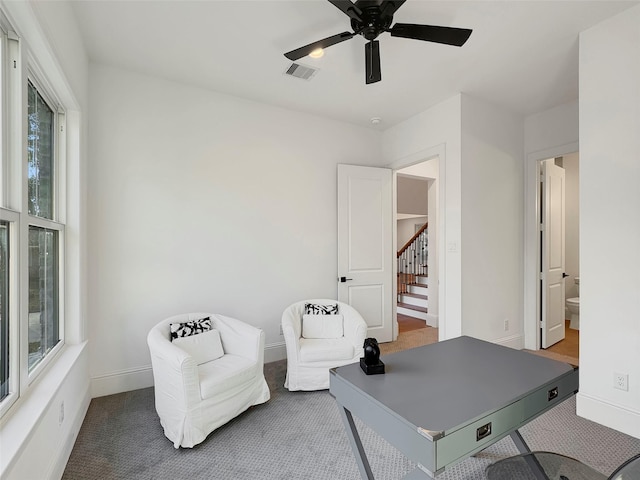 office area with ceiling fan and carpet flooring