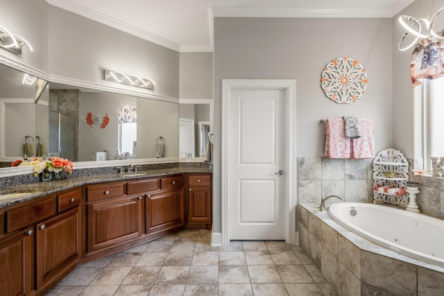 bathroom with crown molding, vanity, and tiled tub