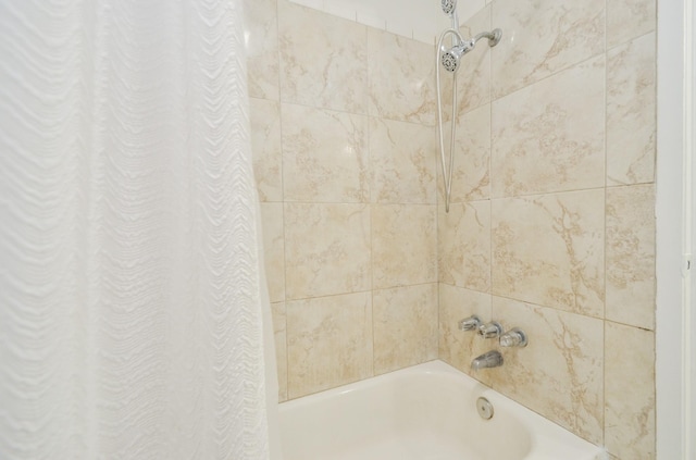 bathroom with shower / bathtub combination with curtain