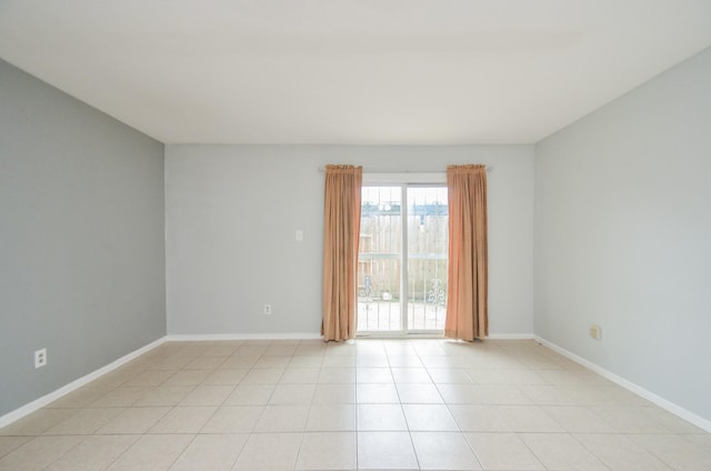 unfurnished room with light tile patterned floors