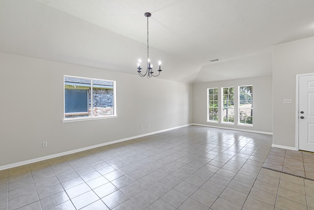 unfurnished room featuring light tile patterned flooring, lofted ceiling, and a chandelier