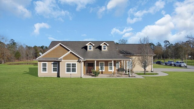 view of front of property with a front lawn and covered porch