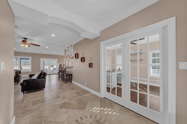 interior space with french doors and ceiling fan