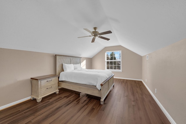 bedroom with dark wood-type flooring, ceiling fan, and lofted ceiling