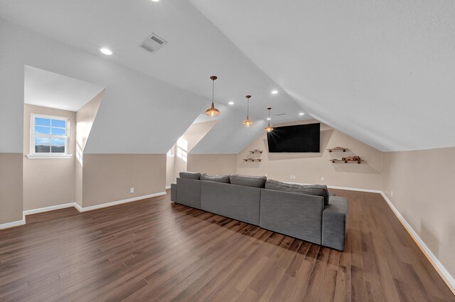 living room featuring lofted ceiling and dark hardwood / wood-style floors