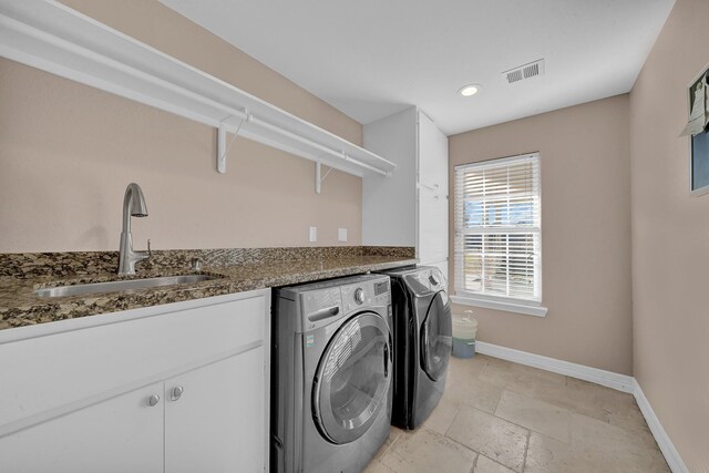 washroom featuring independent washer and dryer and sink